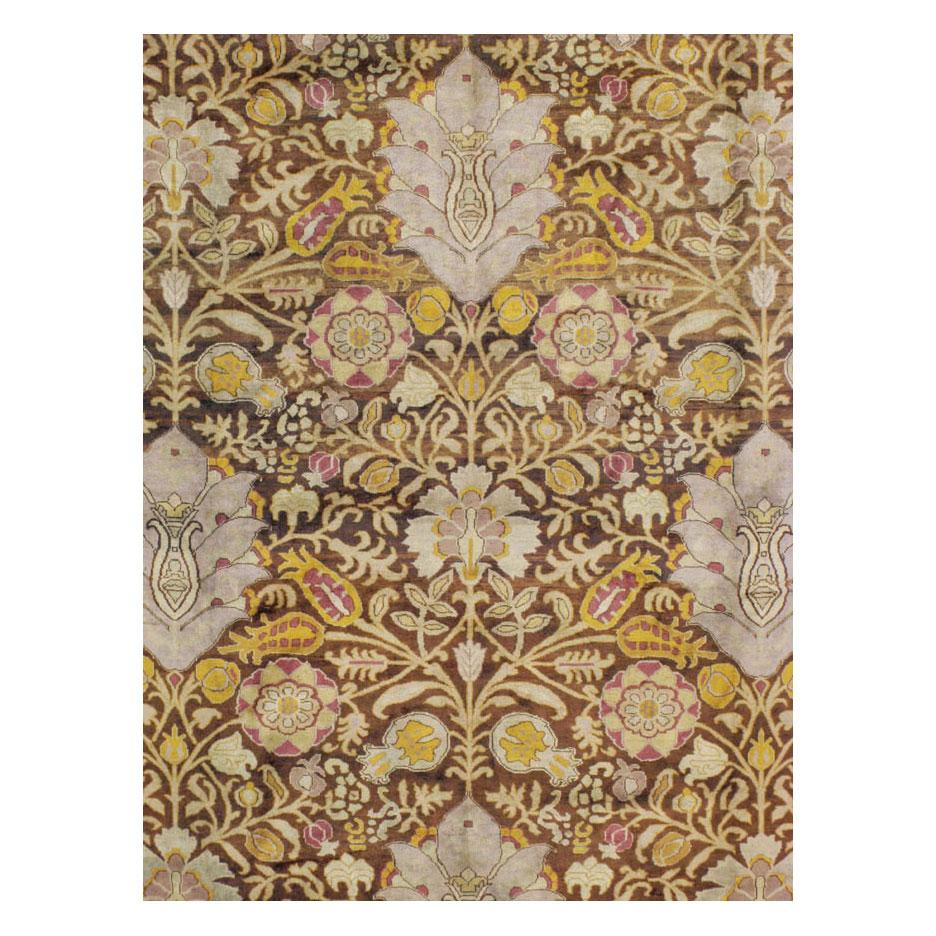 A vintage Indian Lahore large room size carpet handmade during the mid-20th century in the manner of John Henry Dearle's Arts & Crafts style.

Measures: 11' 3