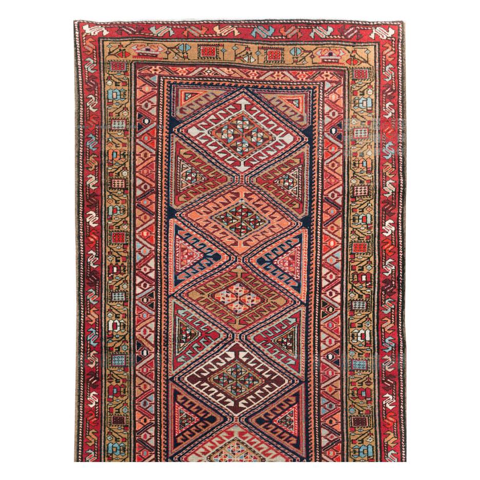 A vintage Northwest Persian runner handmade during the mid-20th century.

Measures: 3' 5
