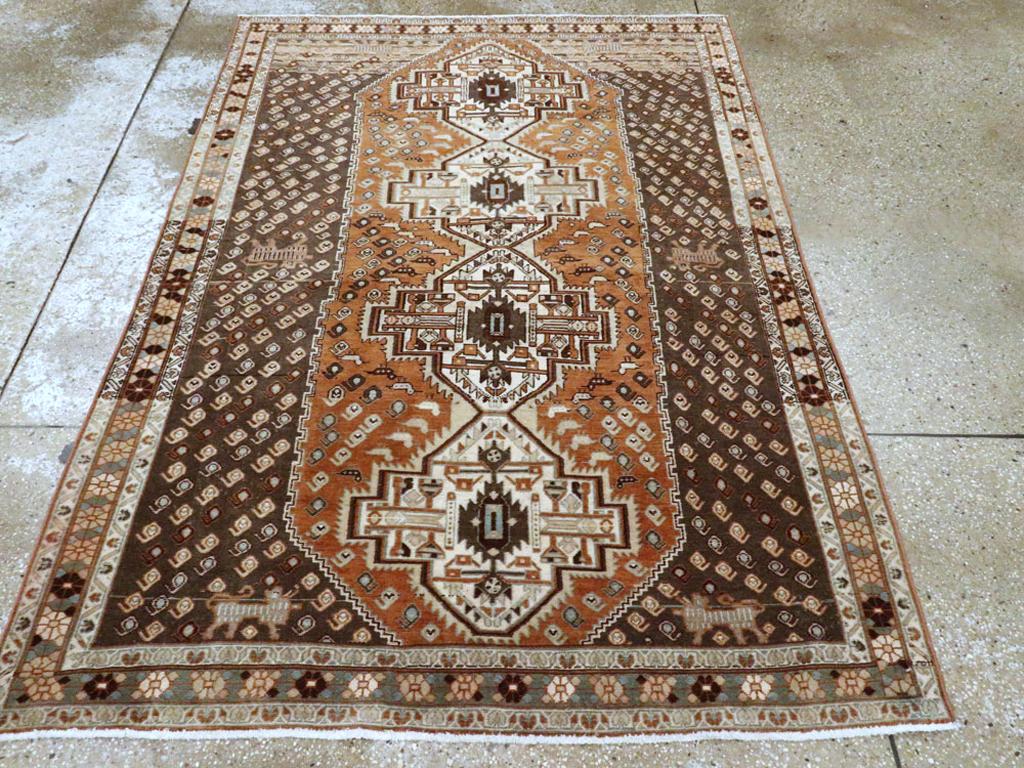 A vintage Persian Afshar tribal accent rug handmade during the mid-20th century.

Measures: 4' 6