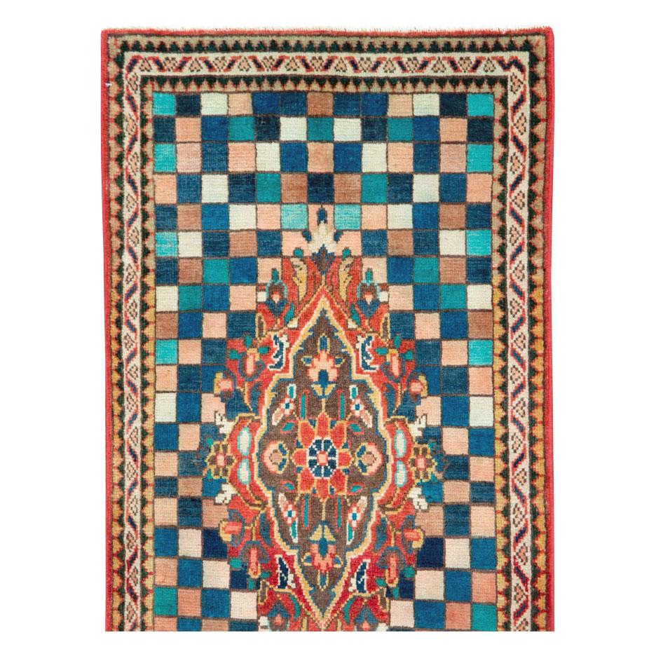 A vintage Persian Art Deco style Mahal small runner handmade during the mid-20th century.

Measures: 2' 2