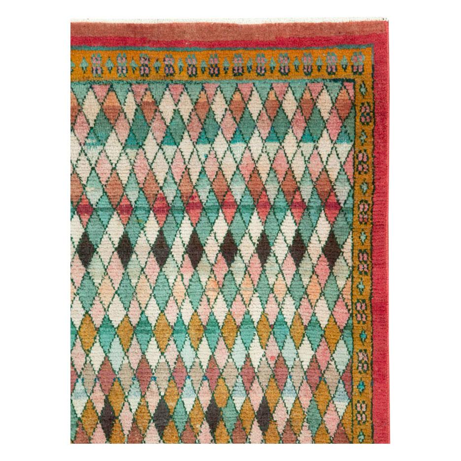 A vintage Persian Art Deco style Mahal throw rug handmade during the mid-20th century with a colorful diamond lattice pattern.

Measures: 3' 1