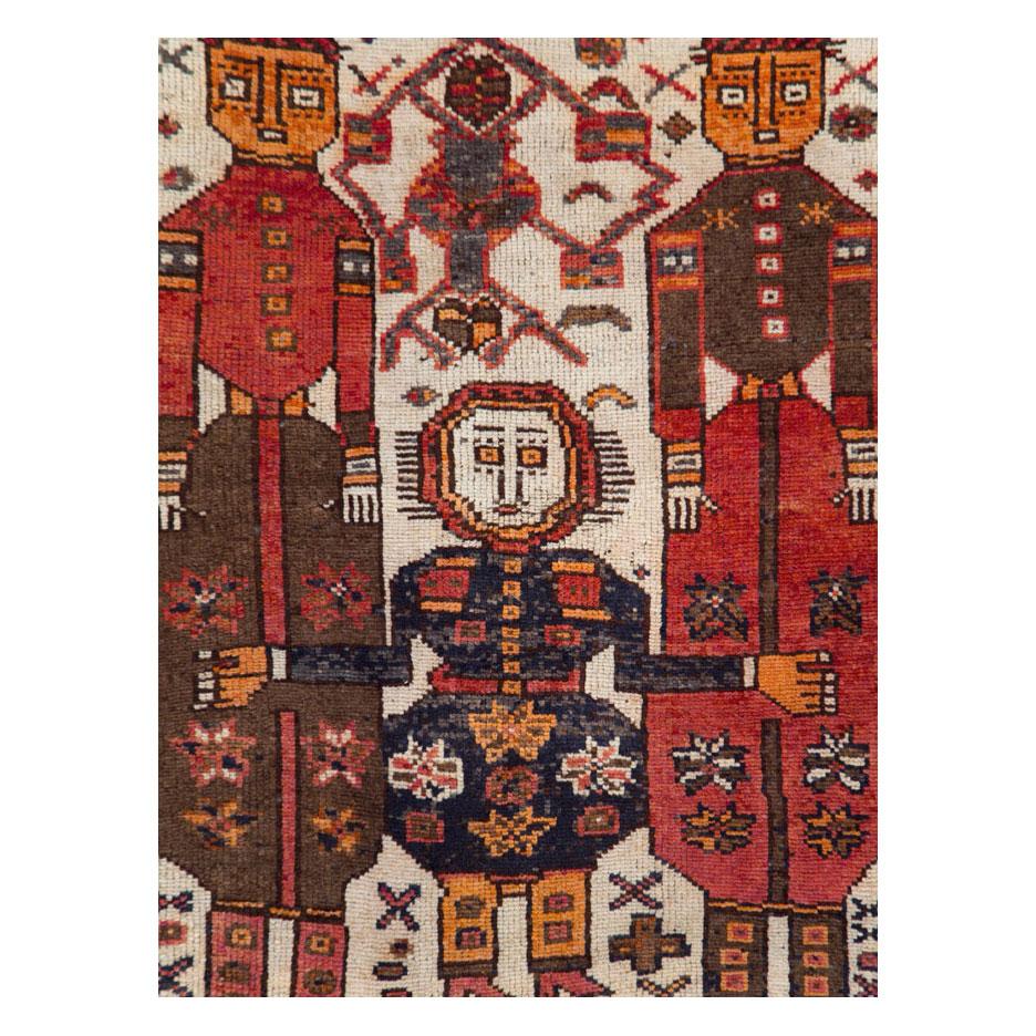 A vintage Persian tribal Bakhtiari gallery carpet handmade during the mid-20th century with a pictorial design.

Measures: 4' 6