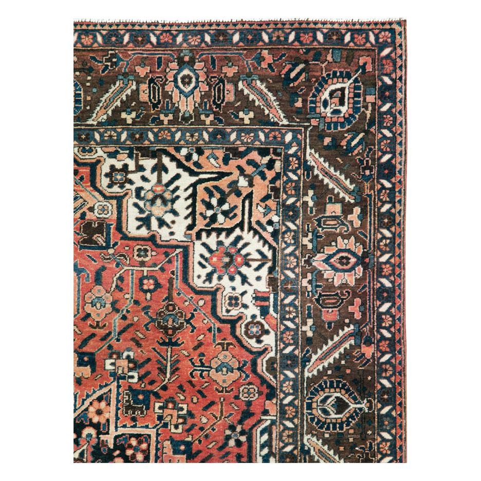 A vintage Persian accent rug handmade by the Bakhtiari tribe during the mid-20th century.

Measures: 5' 2