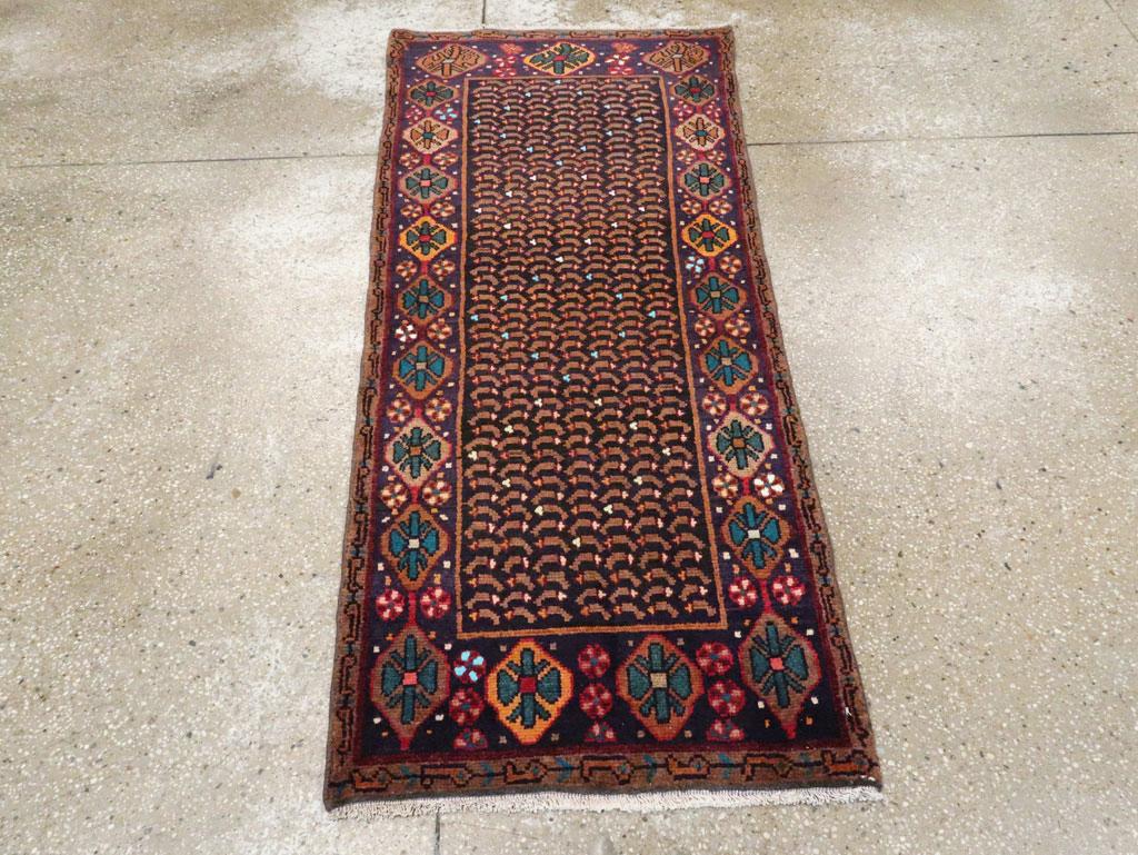 A vintage Persian Baluch throw rug handmade during the mid-20th century.

Measures: 2' 4