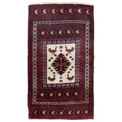 Tapis de baluchon persan fait à la main du milieu du 20e siècle