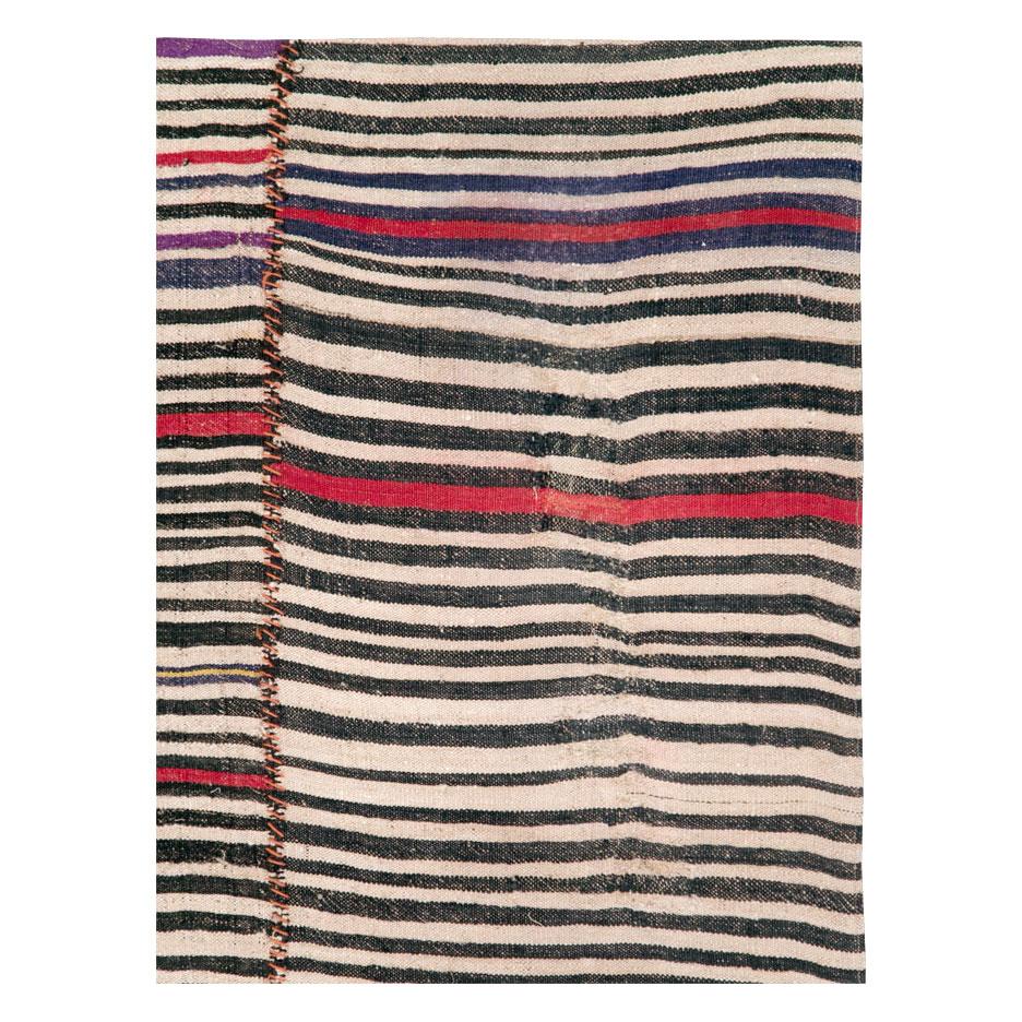 A vintage Persian flat-weave Kilim zebra print small room size accent rug handmade during the mid-20th century in the rustic style that works well with modern farmhouse interiors.

Measures: 6' 0