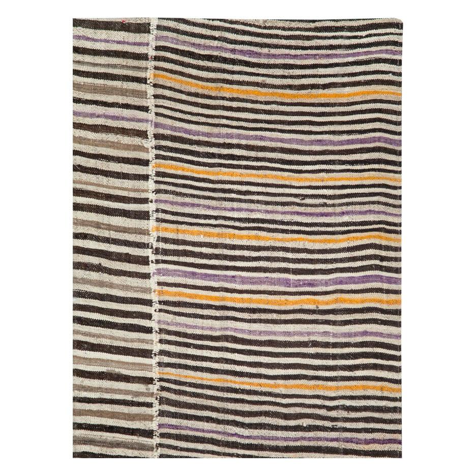 A vintage Persian flat-weave Kilim zebra print small room size accent rug handmade during the mid-20th century in the rustic style that works well with modern farmhouse interiors.

Measures: 5' 11