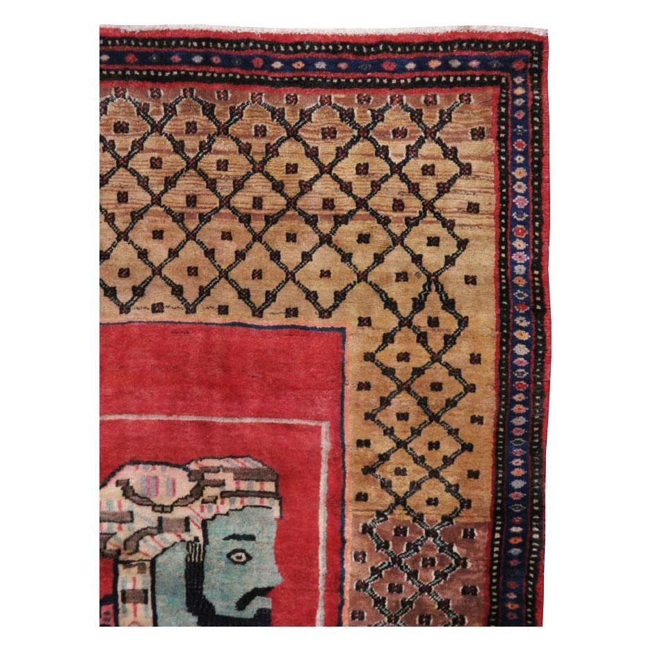 A vintage Persian Hamadan accent rug handmade during the mid-20th century with a pictorial design of a bearded and turbaned male figure with an inscription in Farsi below.

Measures: 4' 9