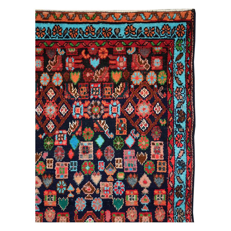 A vintage Persian Hamadan throw rug handmade during the mid-20th century.

Measures: 3' 0