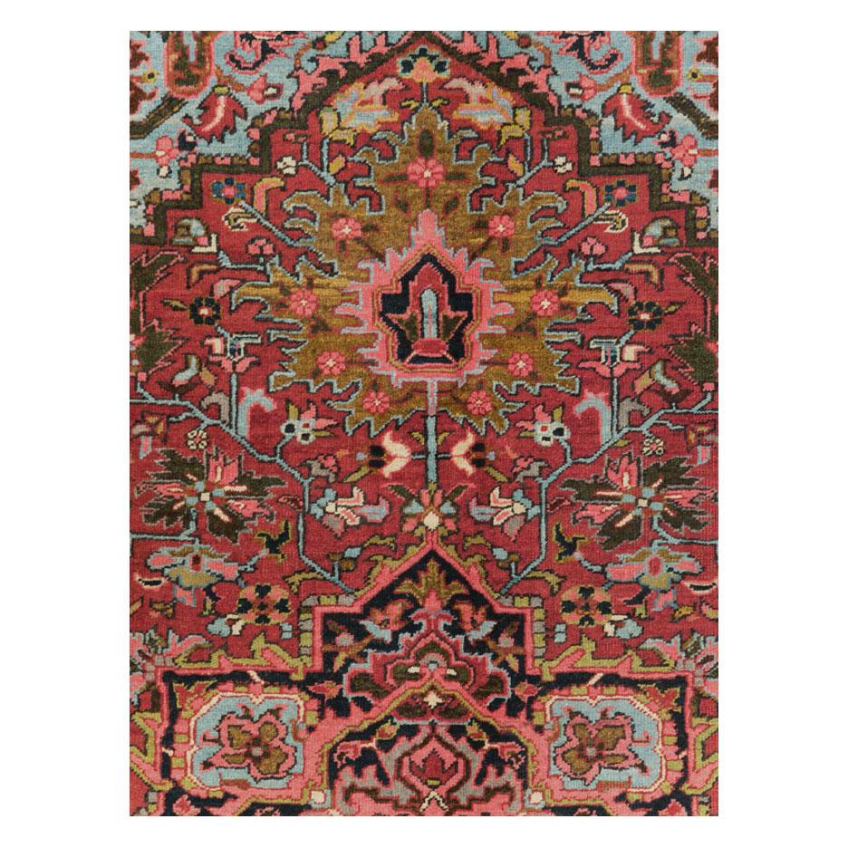A vintage Persian Heriz accent rug handmade during the mid-20th century.

Measures: 6' 7