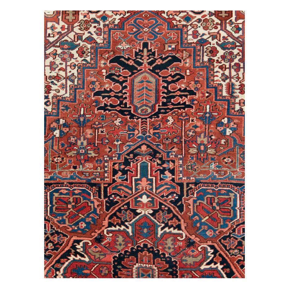 A vintage Persian Heriz large room size carpet handmade during the mid-20th century.

Measures: 11' 5