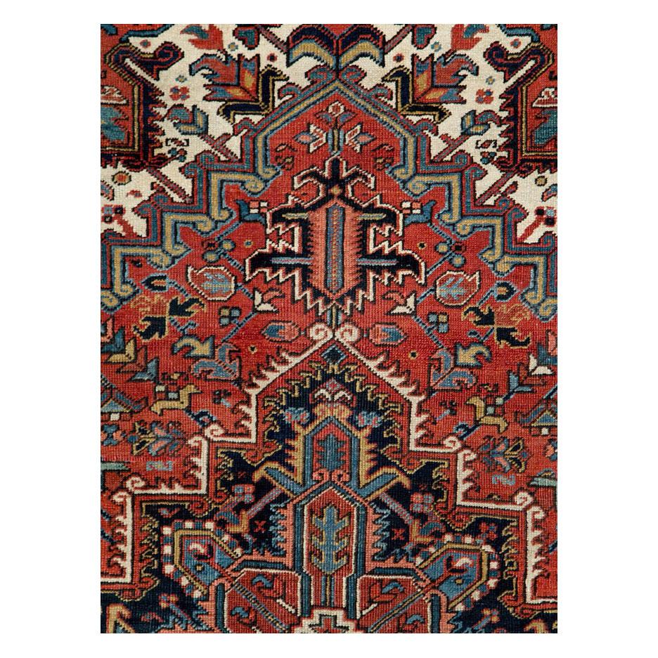 A vintage Persian Heriz rustic accent rug handmade during the mid-20th century.

Measures: 6' 1