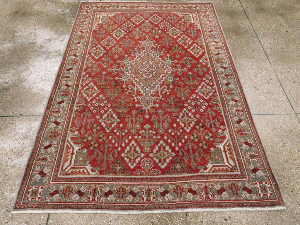 A vintage Persian Joshegan accent rug handmade during the mid-20th century.

Measures: 4' 6