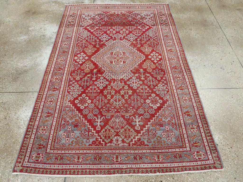 A vintage Persian Joshegan accent rug handmade during the mid-20th century.

Measures: 4' 4