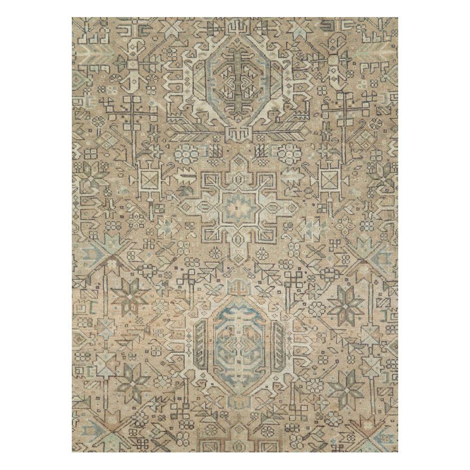 A vintage Persian Karajeh small room size carpet handmade during the mid-20th century with a geometric tribal design in light brown, cream, and grey, with hints of blue-green tones throughout. 

Measures: 8' 1