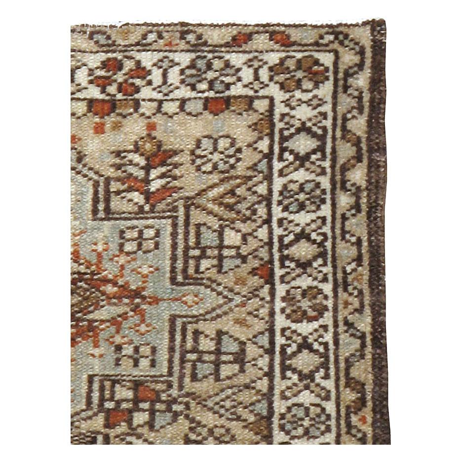 A vintage Persian Karajeh throw rug handmade during the mid-20th century.

Measures: 1' 11