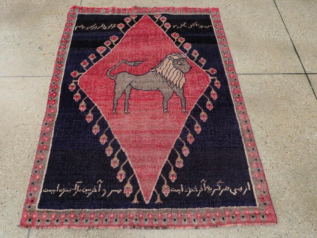 A vintage Persian Kurd throw rug handmade during the mid-20th century with a folk pictorial depiction of a lion.

Measures: 3' 6