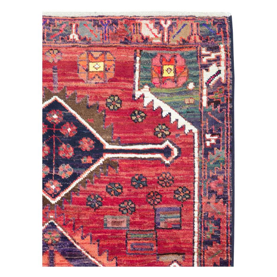 A vintage Persian Kurd throw rug handmade during the mid-20th century.

Measures: 3' 7