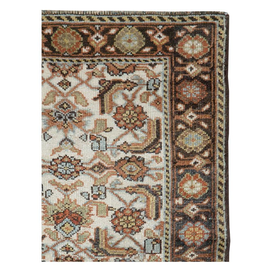 A vintage Persian Mahal throw rug handmade during the mid-20th century.

Measures: 2' 7