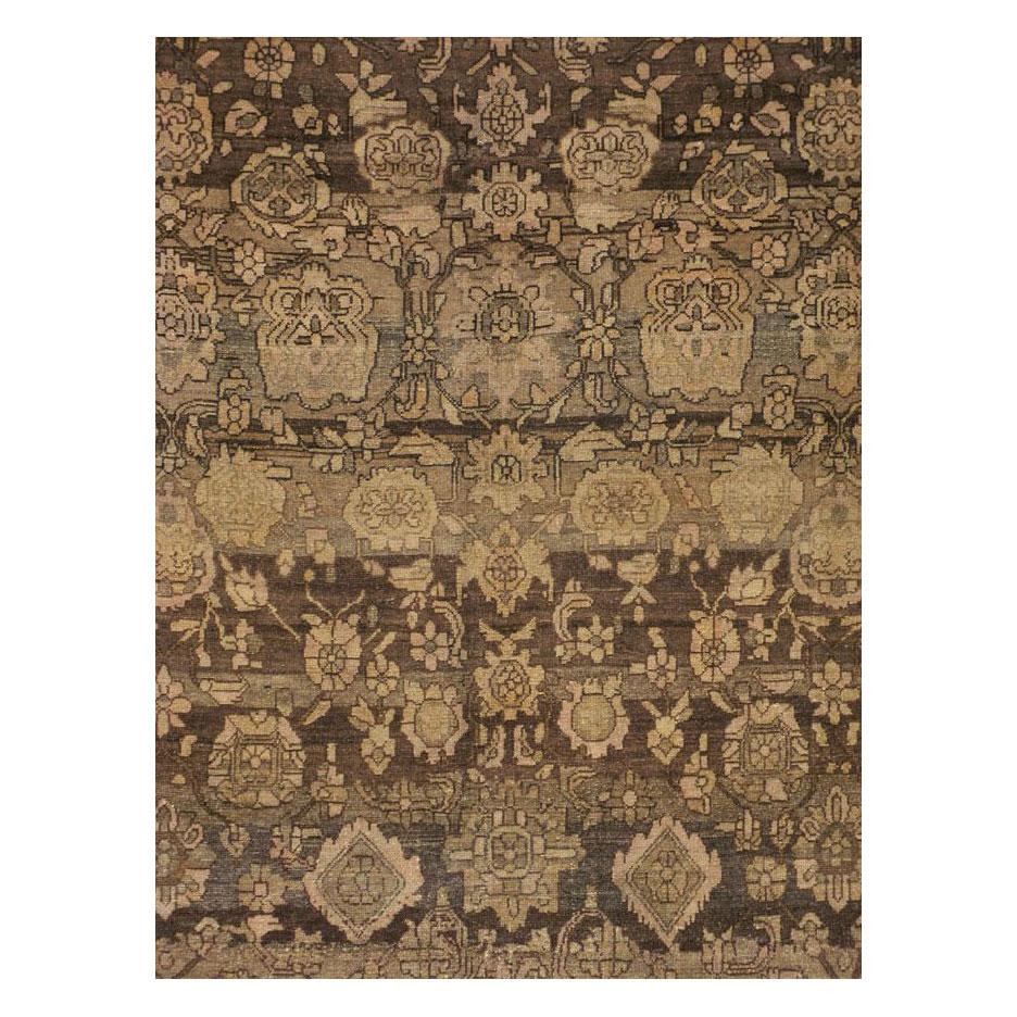A vintage Persian Malayer large room size carpet handmade during the mid-20th century in neutral earth tones including various shades of dark and light brown.

Measures: 10' 7