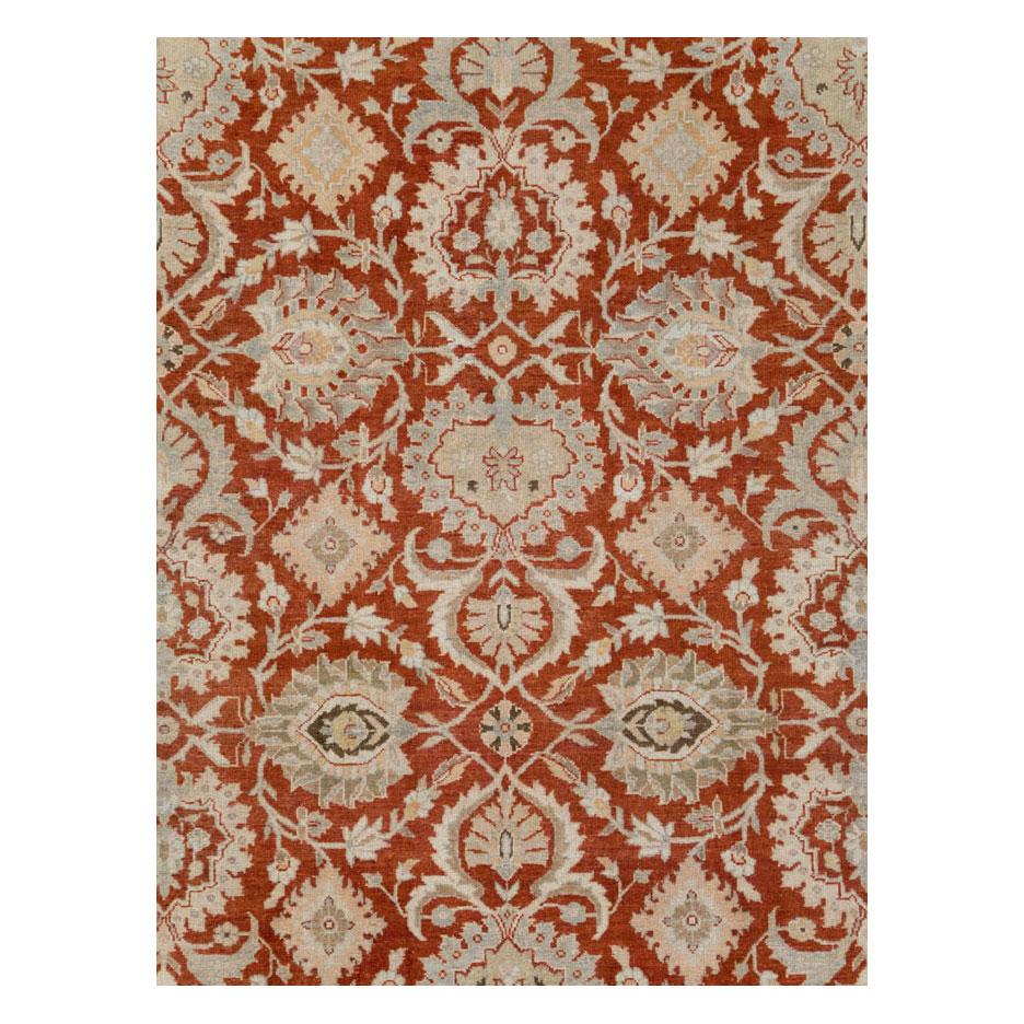 A vintage Persian Malayer large room size carpet handmade during the mid-20th century in shades of rust red and grey.

Measures: 11' 3