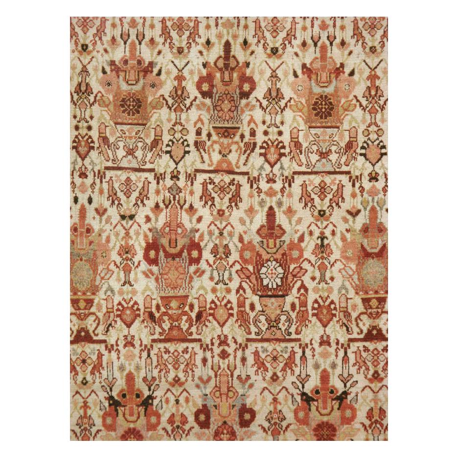 A vintage Persian Malayer room size carpet handmade during the mid-20th century with a pattern inspired by the Zil-i-Sultan (Shadow of the Sultan) design. The carpet is predominantly in shades of red, ivory, and grey along with additional tertiary