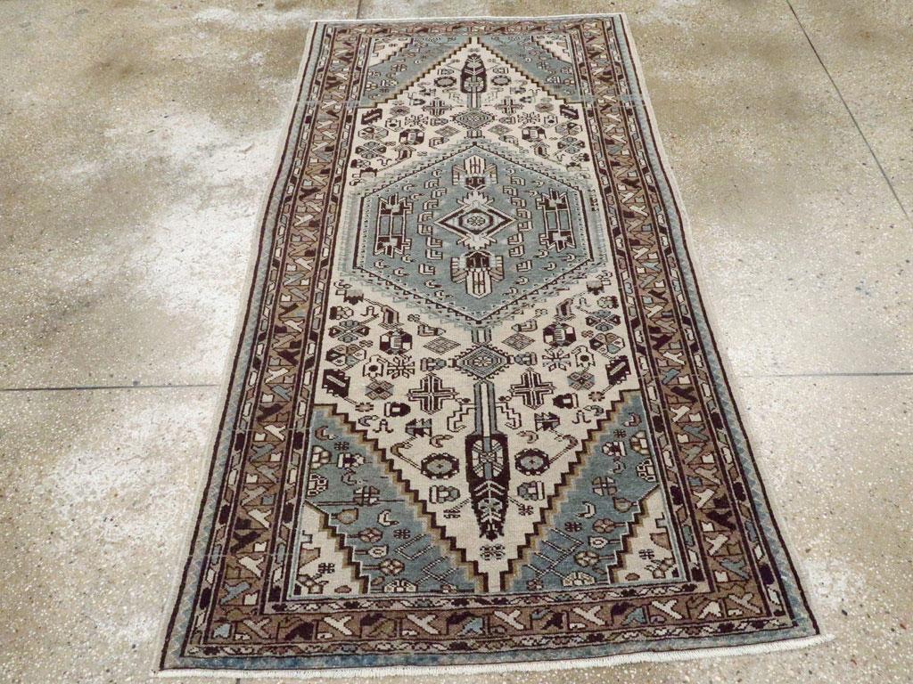 A vintage Persian malayer small accent rug handmade during the mid 20th century.

Measures: 3' 6