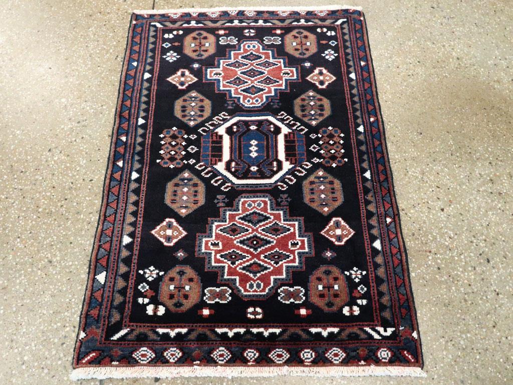 A vintage Persian Malayer small throw rug handmade during the mid-20th century.

Measures: 2' 2