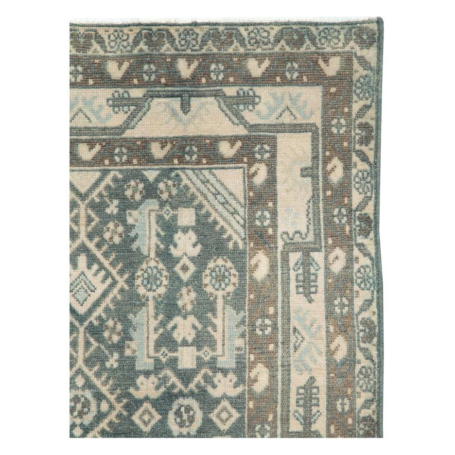 Alfombra persa Malayer de época, hecha a mano a mediados del siglo XX.

Medidas: 3' 6