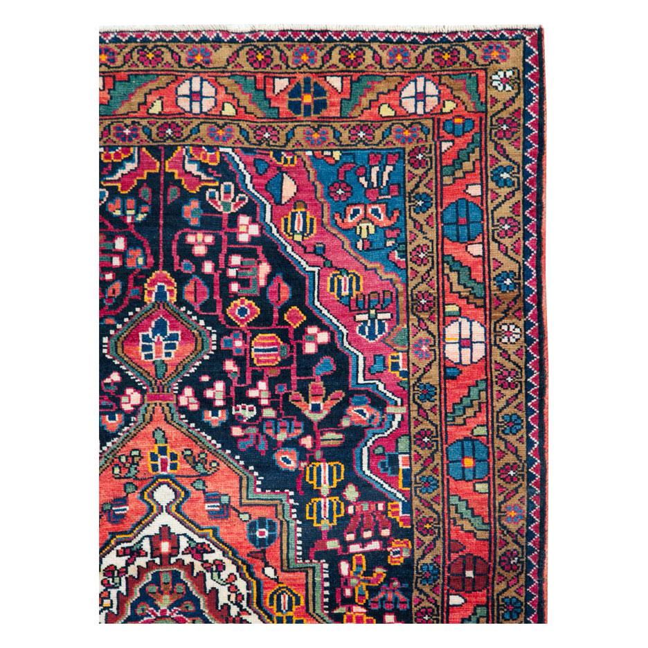A vintage Persian Malayer throw rug handmade during the mid-20th century.

Measures: 3' 8