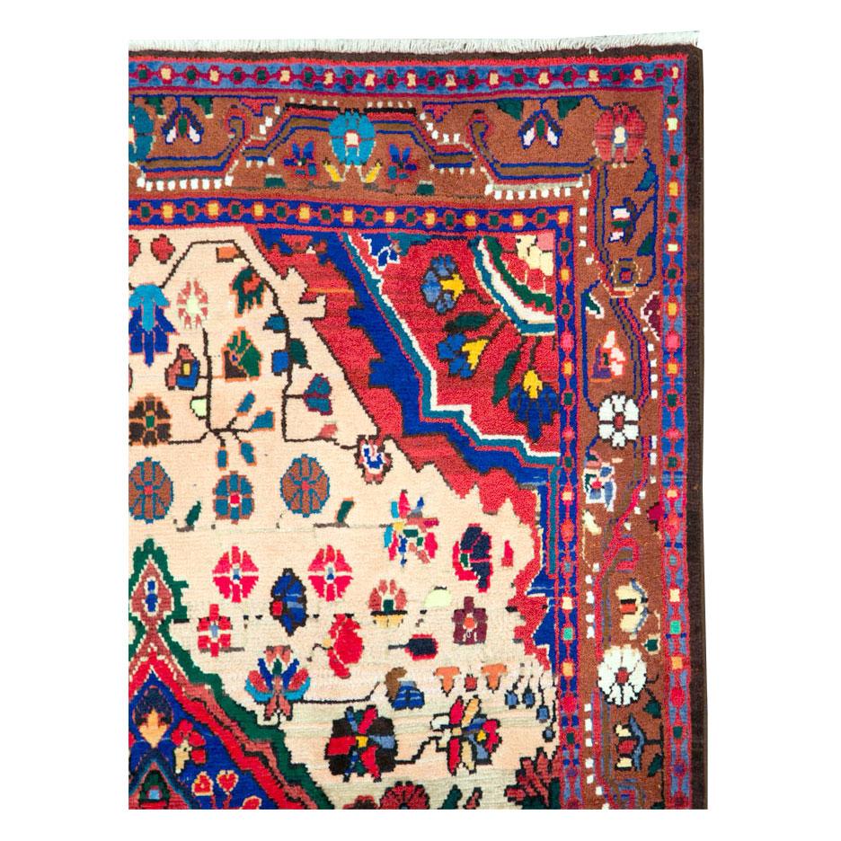 A vintage Persian Malayer throw rug handmade during the mid-20th century.

Measures: 3' 7
