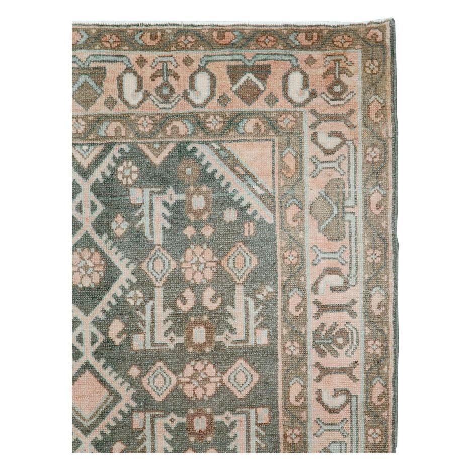 A vintage Persian Malayer throw rug handmade during the mid-20th century.

Measures: 3' 9