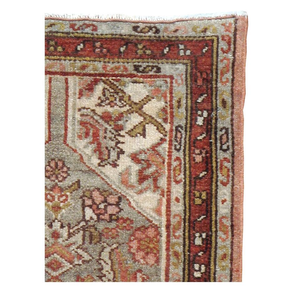 A vintage Persian Malayer throw rug handmade during the mid-20th century.

Measures: 1' 10