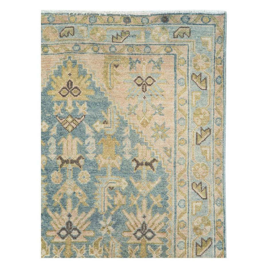 A vintage Persian Malayer throw rug handmade during the mid-20th century in shades of light blue-grey, chartreuse-green, and nude.

Measures: 3' 5
