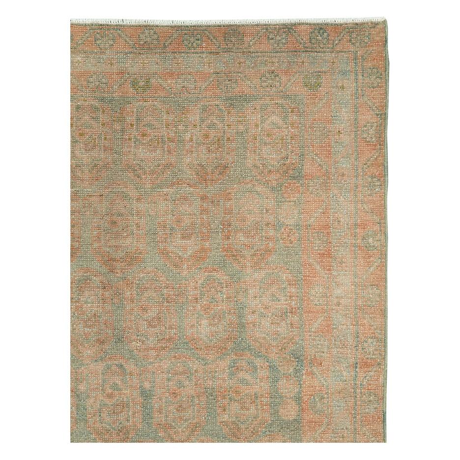 A vintage Persian Malayer throw rug handmade during the mid-20th century in shades of khaki green and rust.

Measures: 3' 6