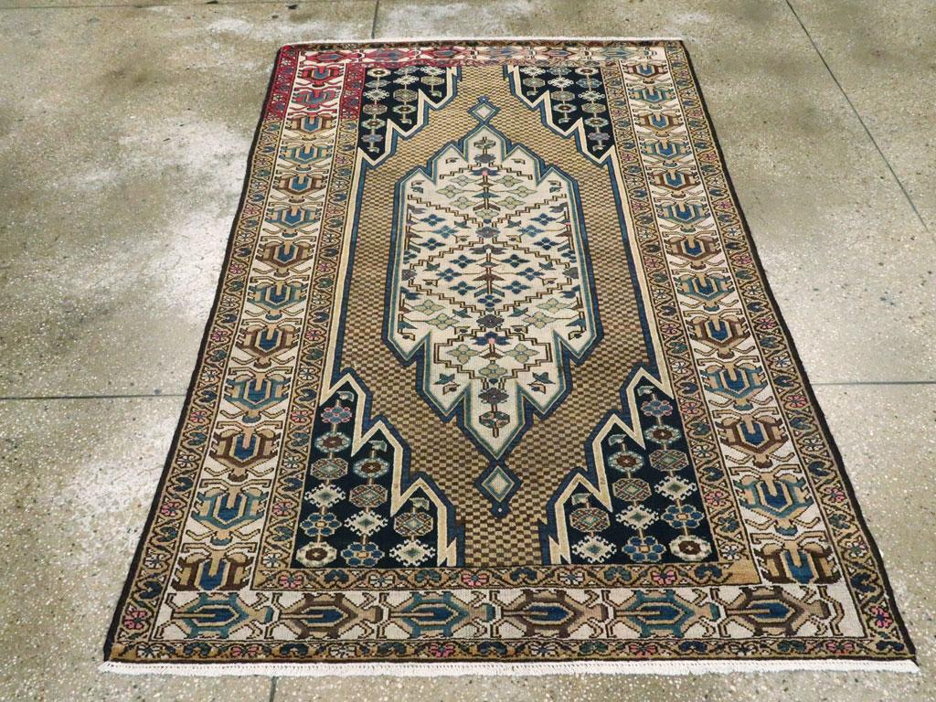A vintage Persian Malayer accent rug handmade during the Mid-20th Century with the characteristic Mazlagan lightning bolt medallion. 

Measures: 4' 3