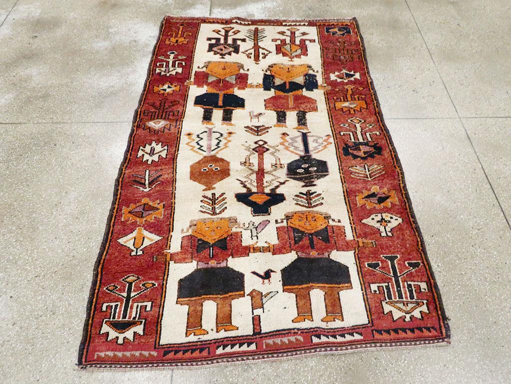 A vintage Persian pictorial Bakhtiari accent rug handmade during the mid-20th century.

Measures: 4' 8