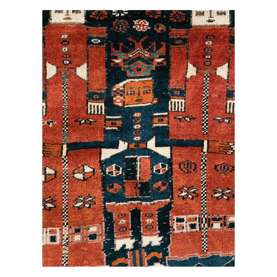 A vintage Persian pictorial Bakhtiari accent rug handmade during the mid-20th century.

Measures: 5' 0