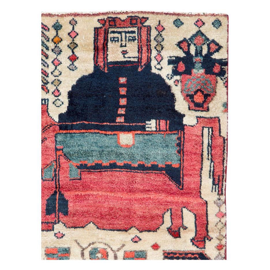 A vintage Persian pictorial Bakhtiari throw rug handmade during the mid-20th century.

Measures: 2' 8