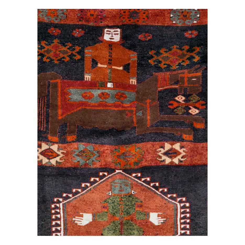 A vintage Persian pictorial gallery format rug handmade by the Bakhtiari tribe during the mid-20th century.

Measures: 4' 11