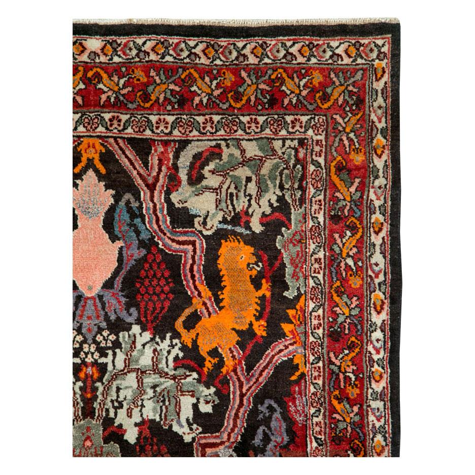 A vintage Persian Bidjar accent rug handmade during the mid-20th century with a pictorial design.

Measures: 4' 7