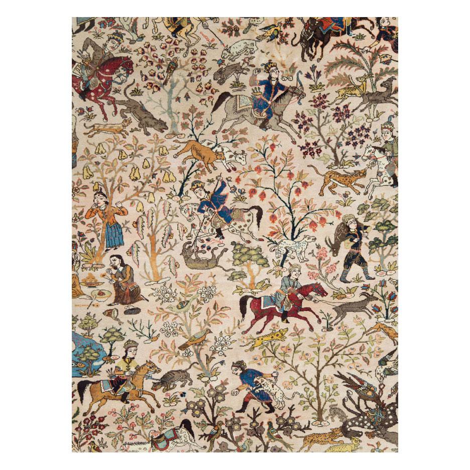 A vintage Persian Tabriz pictorial hunting ground room size carpet handmade during the mid-20th century.

Measures: 9' 11