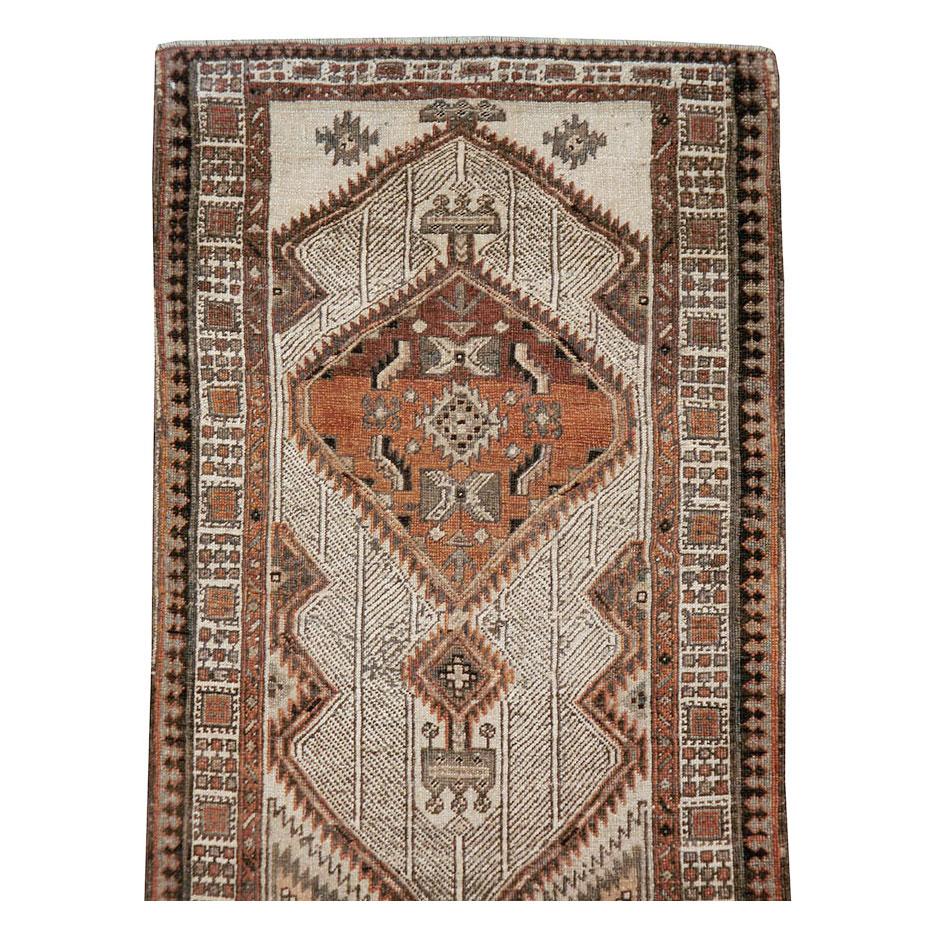 A vintage Persian Serab rug in runner format handmade during the mid-20th century.

Measures: 2' 11