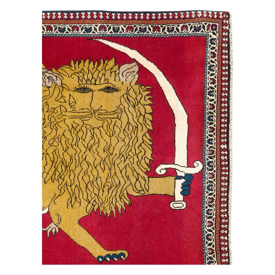 A vintage Persian Shiraz throw rug handmade during the mid-20th century with a whimsical pictorial depiction of the 'Lion and Sun' emblem.

Measures: 3' 5