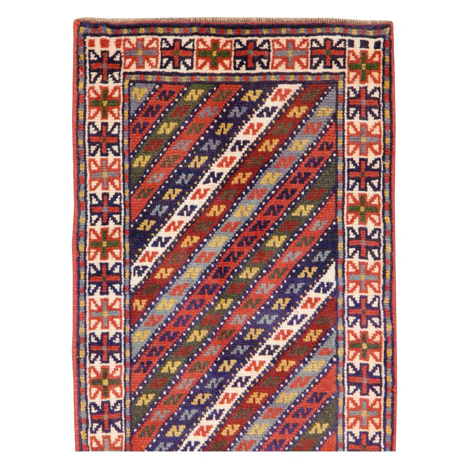 A vintage Persian Shiraz rug in small runner format handmade during the mid-20th century.

Measures: 2' 0