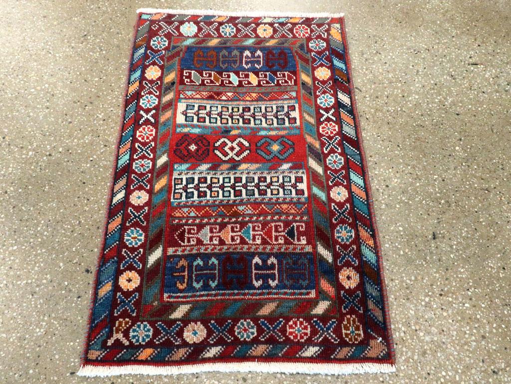 A vintage Persian Shiraz throw rug handmade during the mid-20th century in vivid tones.

Measures: 1' 8