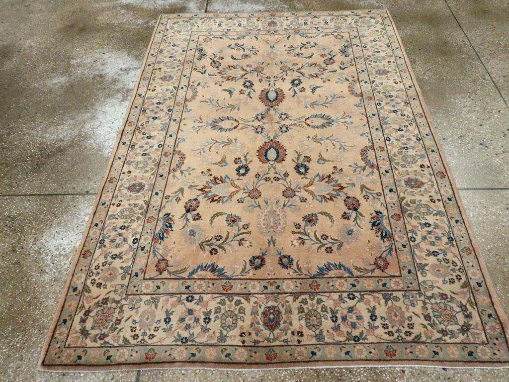 A vintage Persian Tabriz accent rug handmade during the Mid-20th Century.

Measures: 4' 6