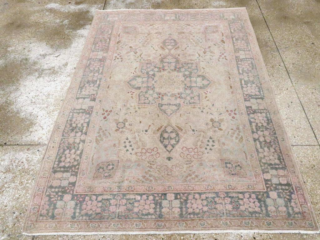 A vintage Persian Tabriz accent rug handmade during the mid-20th century.

Measures: 4' 5