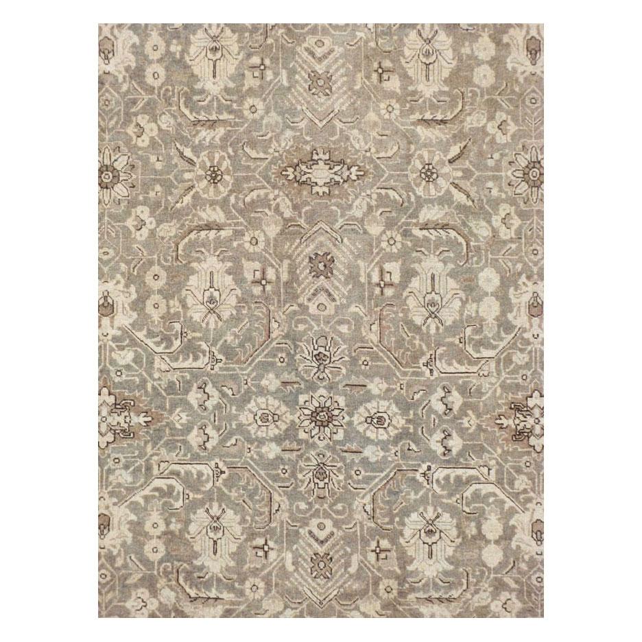 A vintage Persian Tabriz room size carpet handmade during the mid-20th century.

Measures: 8' 11