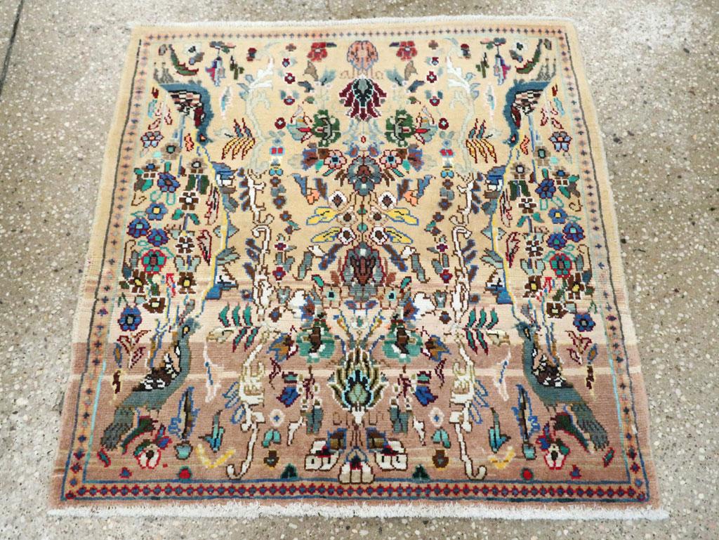 A vintage Persian Tabriz square throw rug handmade during the mid-20th century.

Measures: 2' 2